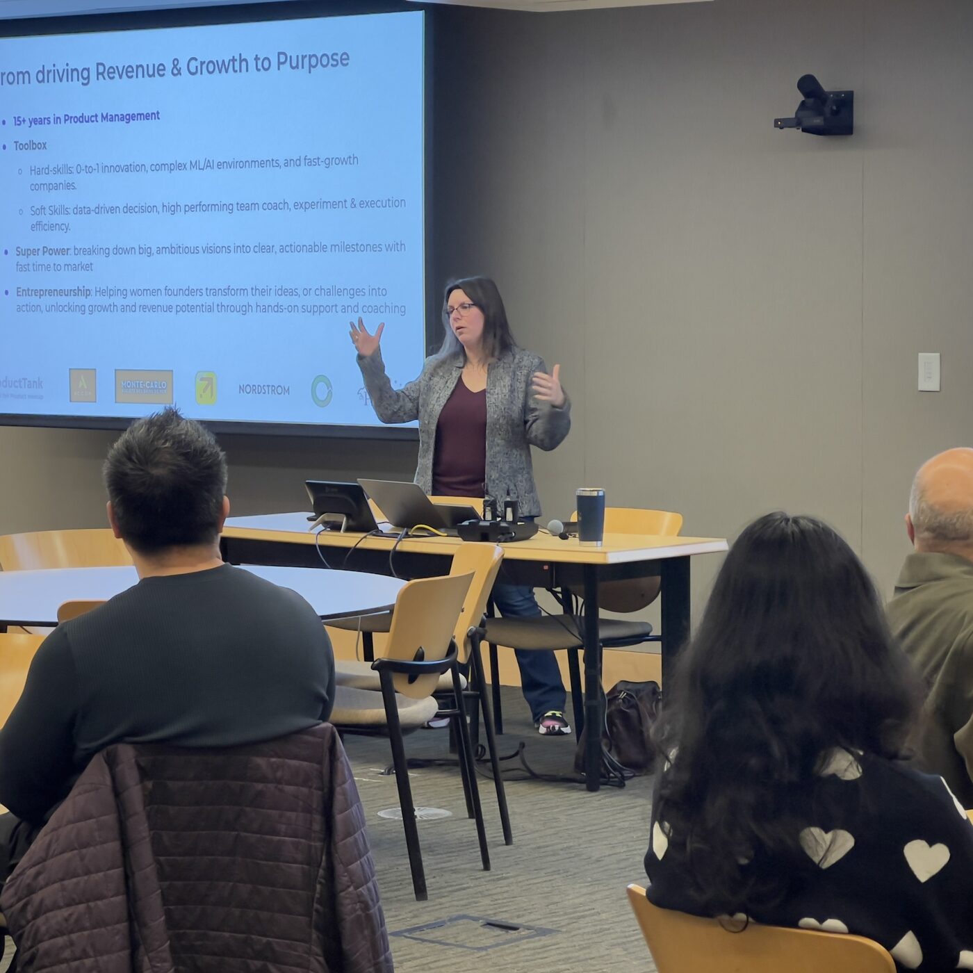Laure Marchand presenting to a live audience